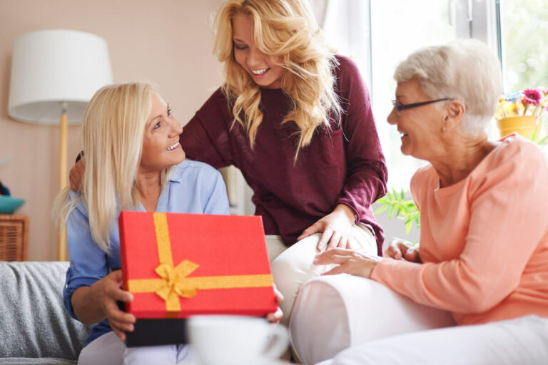 Civitas Senior Living | Senior woman getting a subscription box from her daughter
