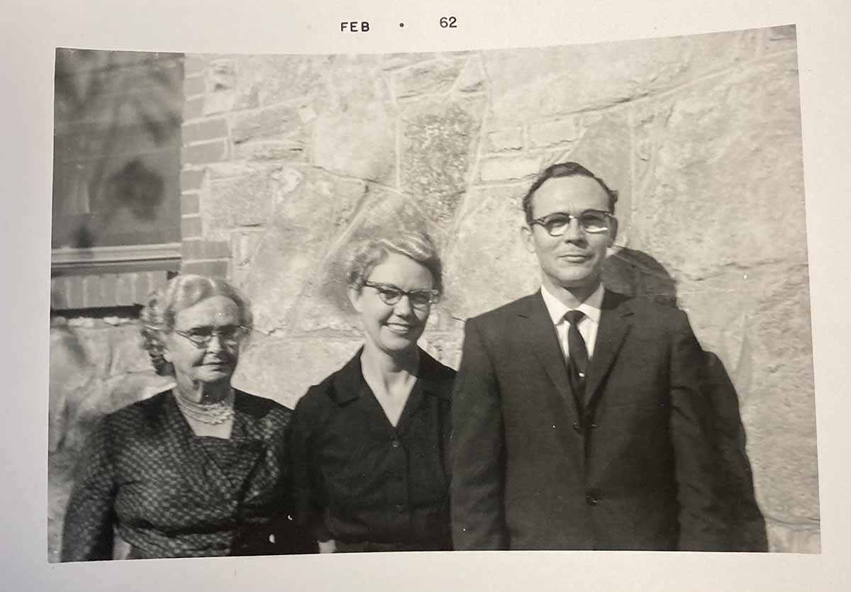 StoneCreek of Edmond | Black and white photo of main in a suit and two women smiling