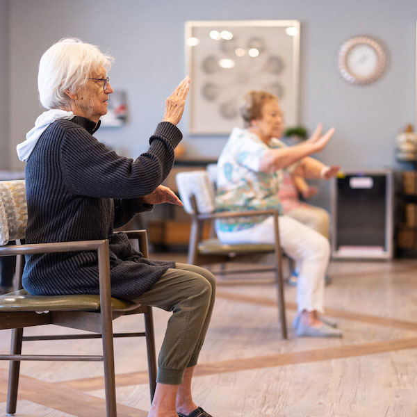 StoneCreek of Edmond | Seniors doing chair yoga