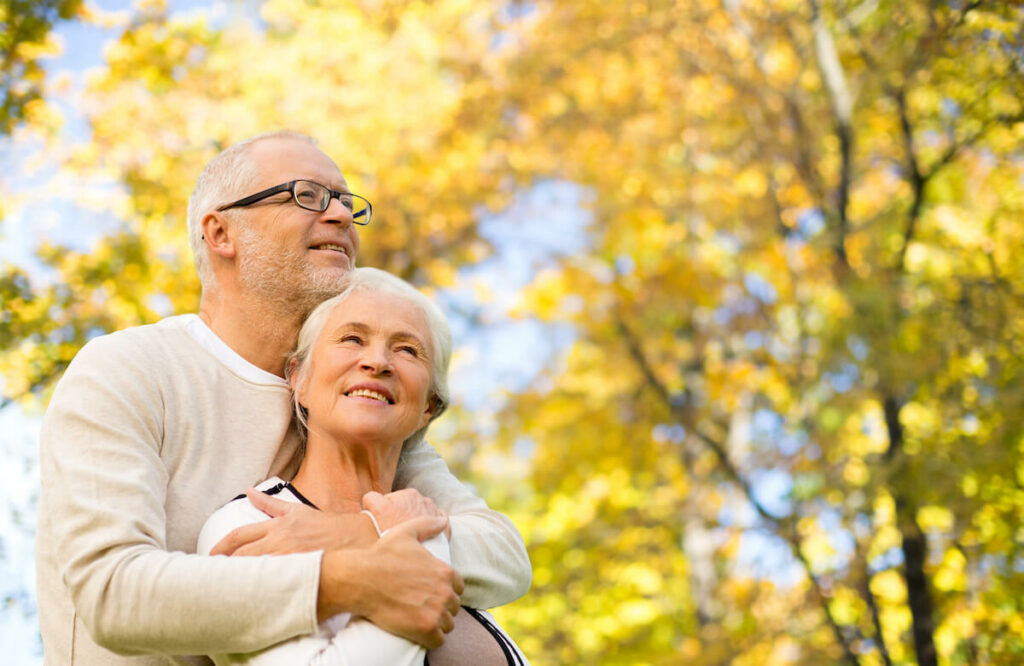 StoneCreek of Flying Horse | Senior couple enjoying the autumn day in the park