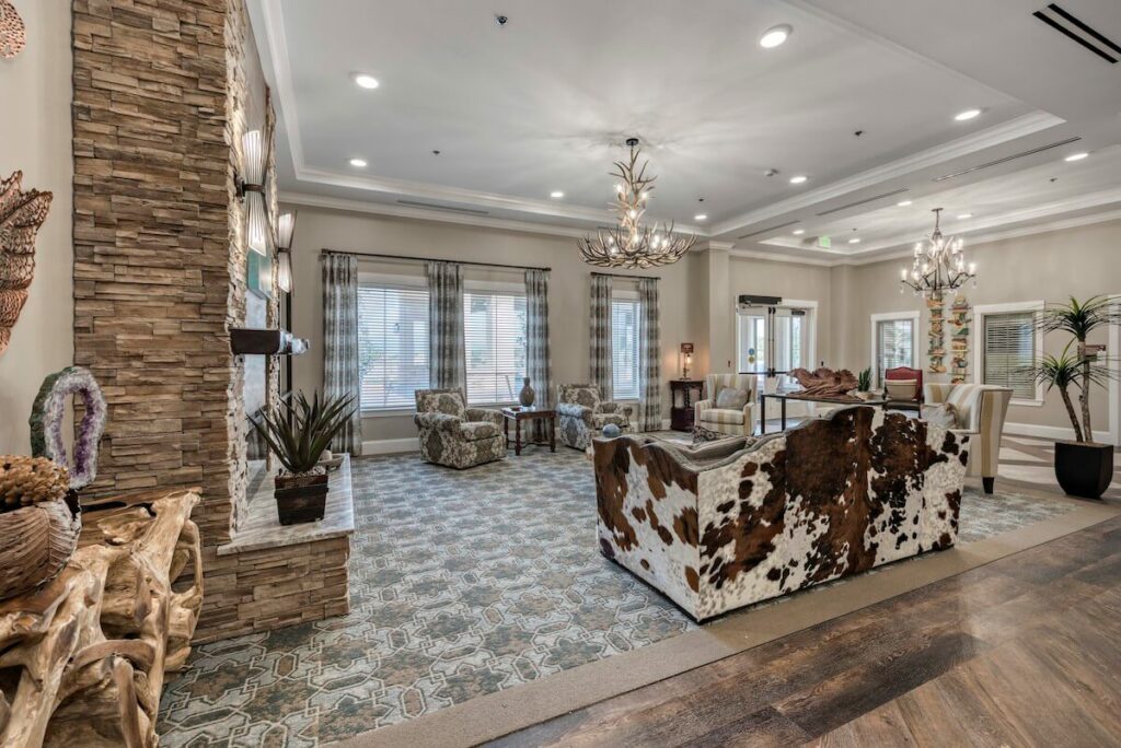 StoneCreek of Flying Horse | Living area with fireplace