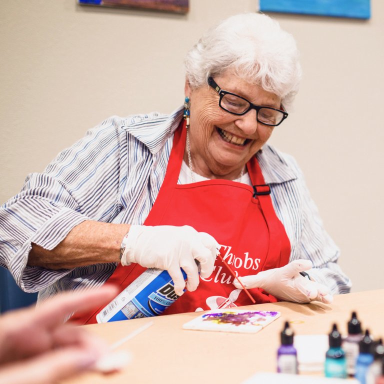 StoneCreek of Flying Horse | Senior woman crafting