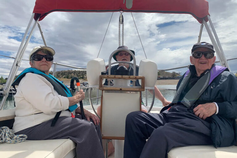 StoneCreek of Flying Horse | Senior couple smiling on a boat