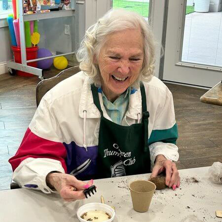 StoneCreek of Flying Horse | Senior having fun making food