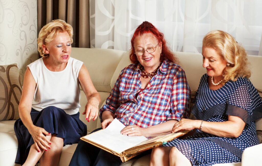 StoneCreek of Flying Horse | Senior women looking through a book