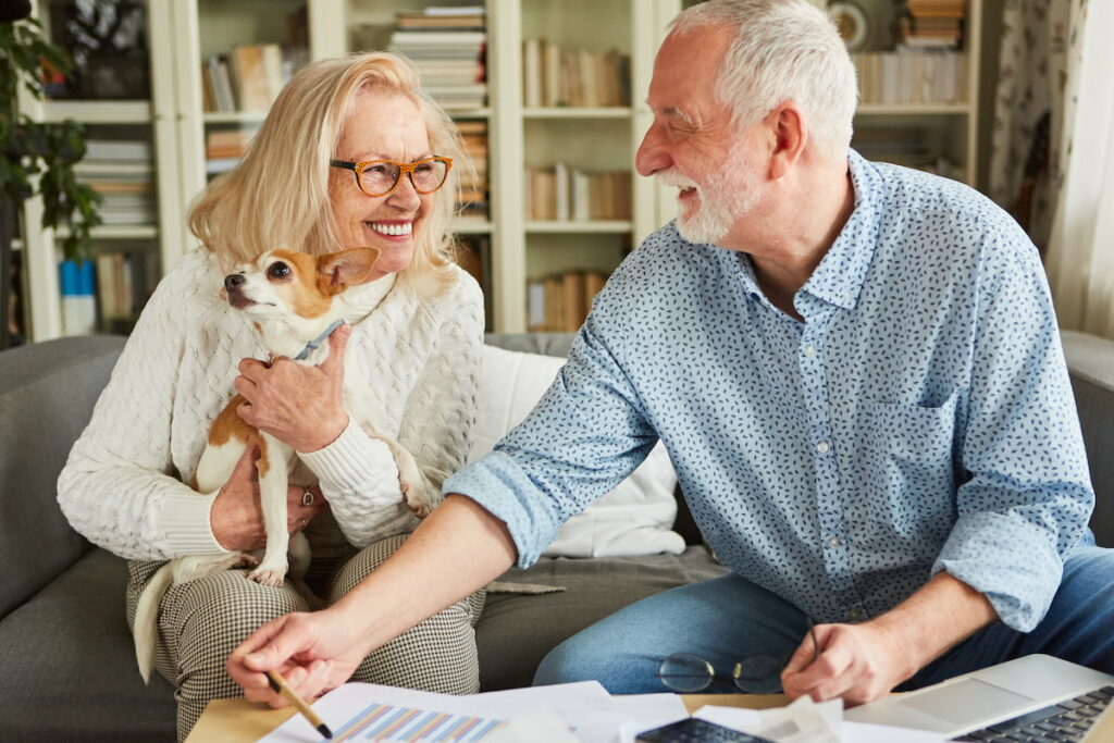 Civitas Senior Living | Happy senior couple discussing retirement savings