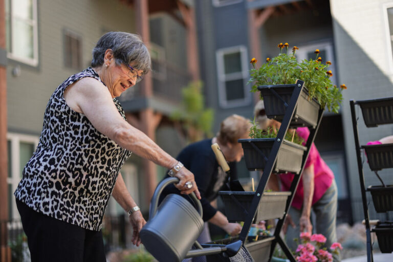 StoneCreek of Littleton | Senior woman gardening at garden club