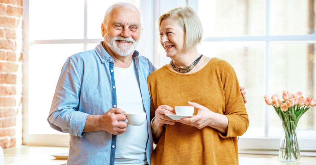 StoneCreek of North Richland Hills | Happy seniors drinking tea in kitchen