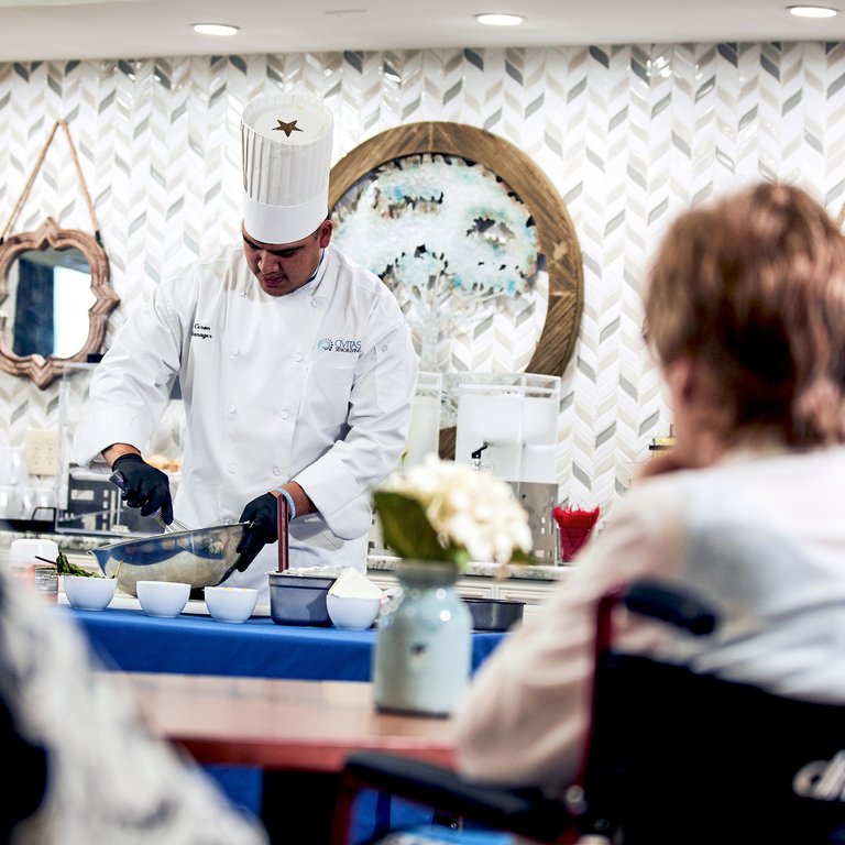 StoneCreek of North Richland Hills | Senior woman watching a chef demonstration