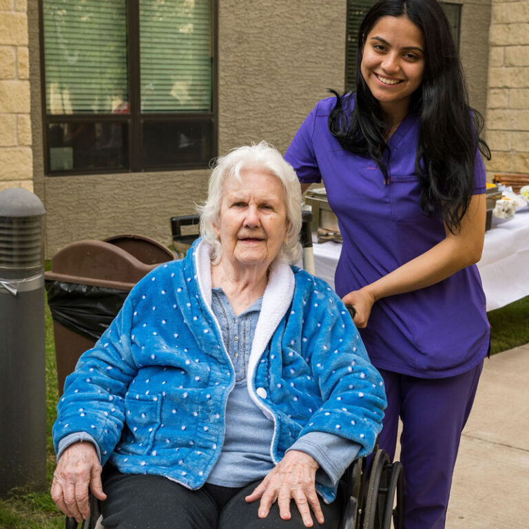 Tech Ridge Oaks | Associate helping senior in wheelchair
