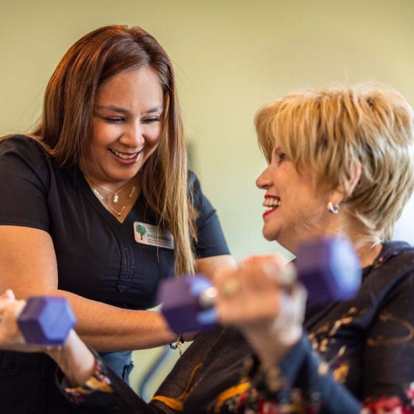 Tech Ridge Oaks | Resident exercising with caregiver