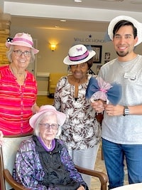 The Avenues of Forth Bend | Christopher posing for pictures with senior residents