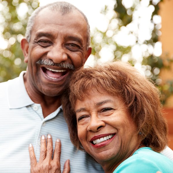 The Avenues of Fort Bend | Senior couple smiling with woman's head on man's shoulder