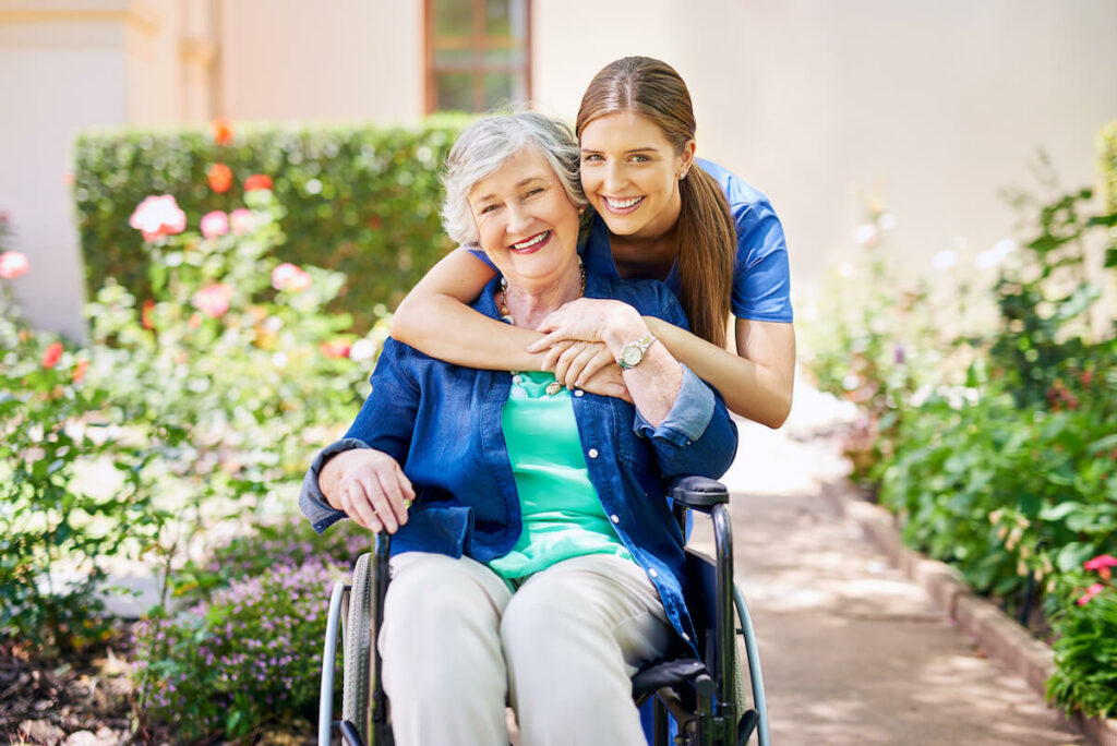 The Avenues of Fort Bend | Our Passionate Leader | Happy senior woman in a wheelchair and her caregiver out for a walk