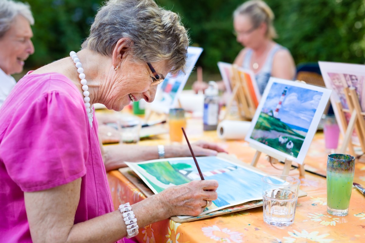 The Avenues of Fort Bend | Seniors smiling while painting