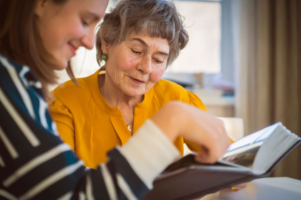 The Bluffs of Flagstaff | Senior woman looking at photos with a friend