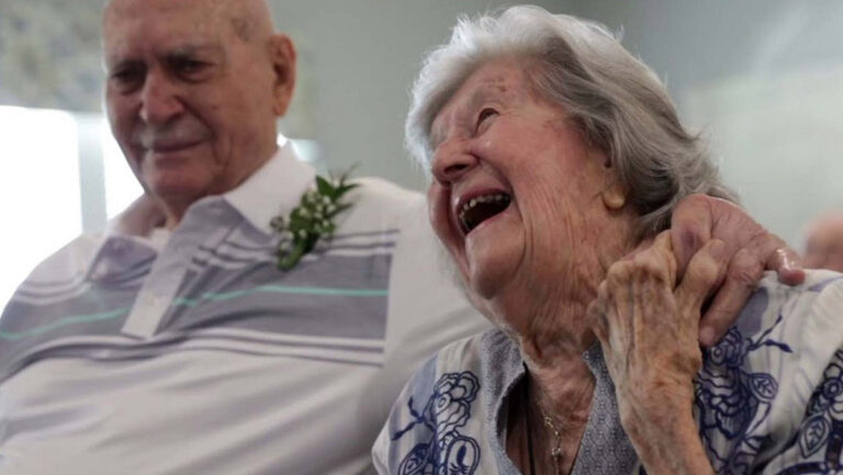 The Bluffs of Flagstaff | Senior couple laughing and holding hands