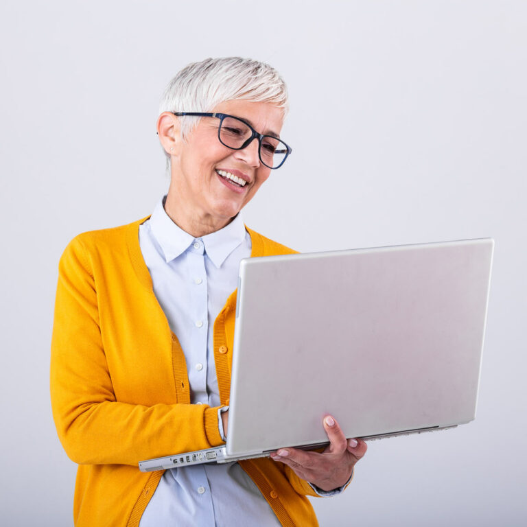 The Bluffs of Flagstaff | Senior woman using laptop