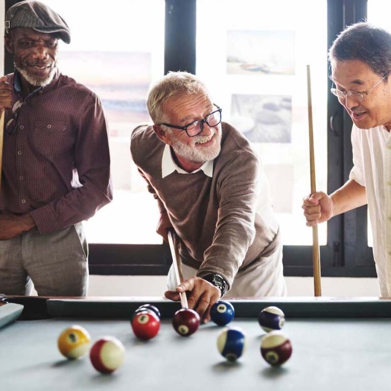 The Bluffs of Flagstaff | Seniors playing a game of pool