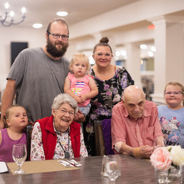 The Bluffs of Flagstaff | Senior residents and family smiling