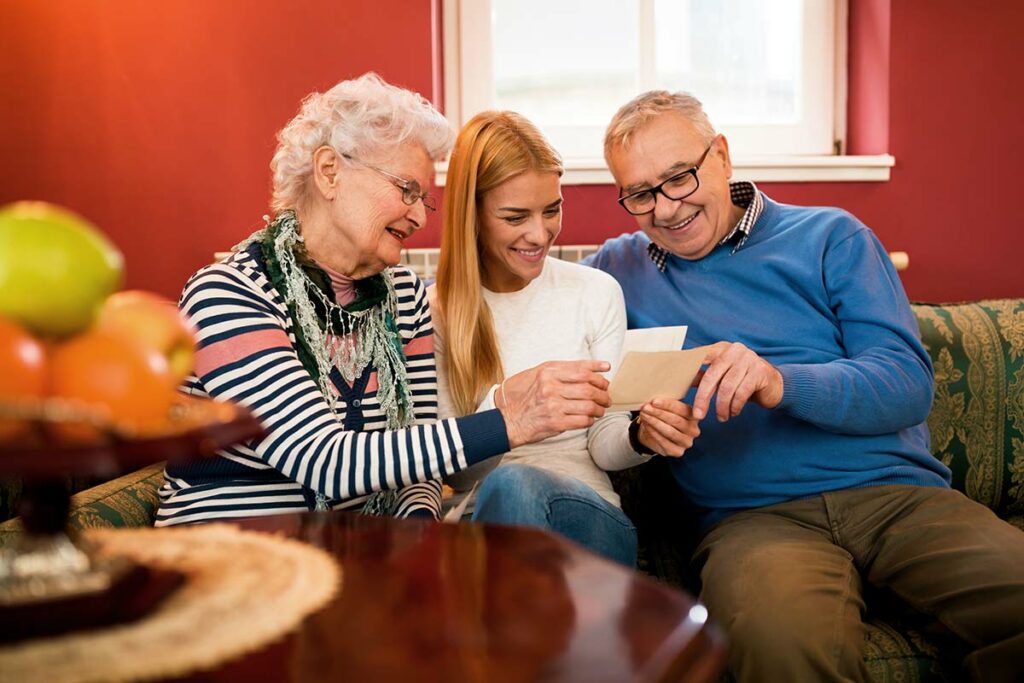 The Bluffs of Flagstaff | Seniors looking at photographs with family members