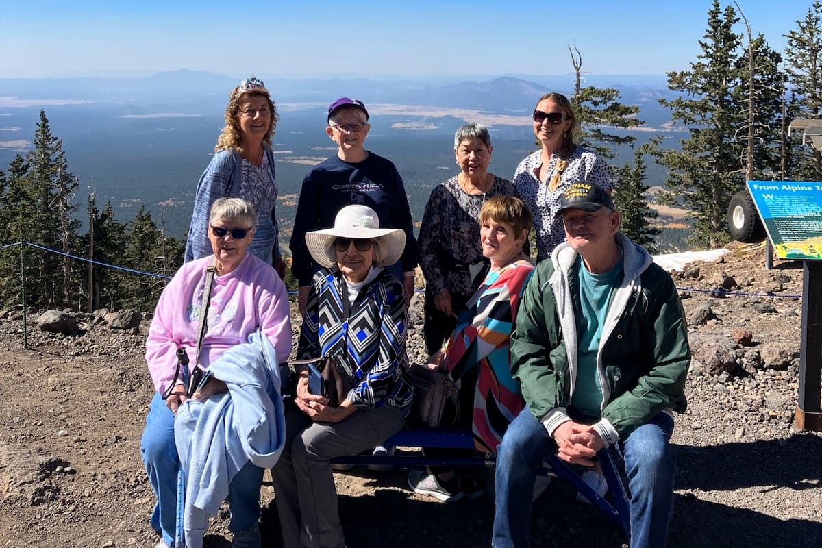 The Bluffs of Flagstaff | Residents on the side of a mountain in front of a beautiful view