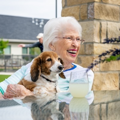 Civitas Senior Living | Senior woman with small dog