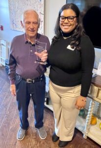 The Grand Senior Living | Senior resident receiving an honor