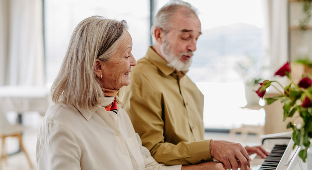 The Grandview of Chisholm Trail | Senior couple playing on piano together