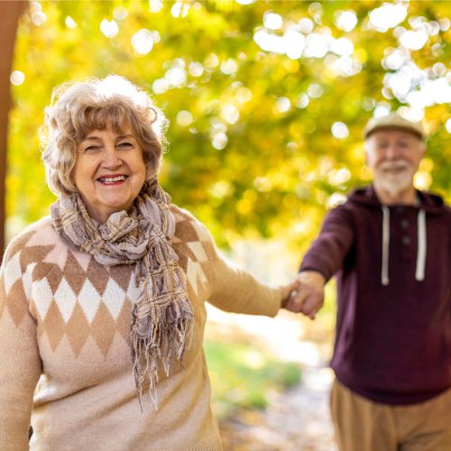 Civitas Senior Living | Happy senior couple walking in Autumn