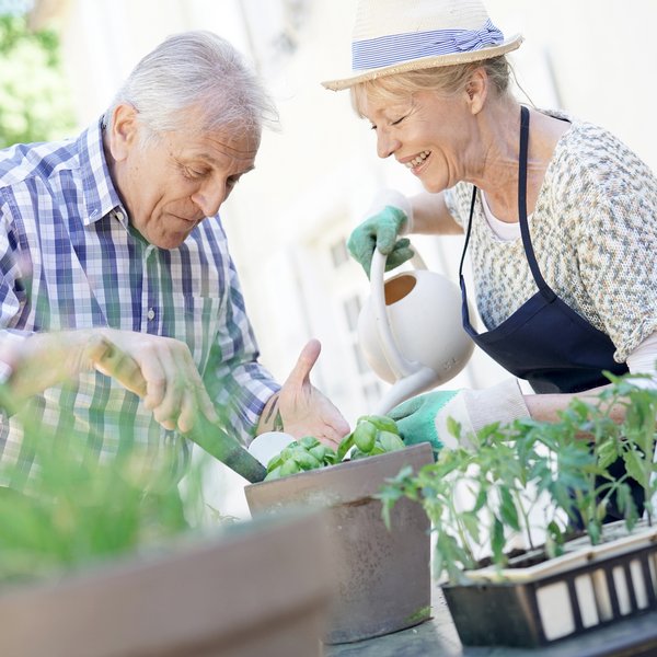 The Hamptons | Senior couple gardening