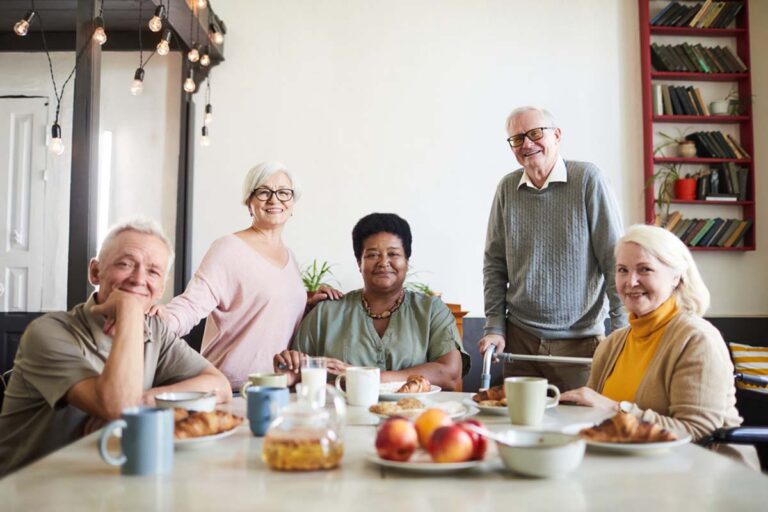 Civitas Senior Living | seniors posing at table
