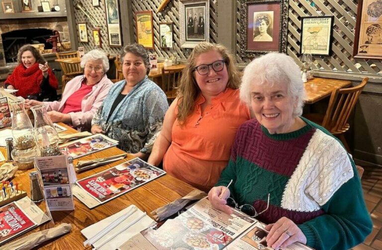 The Hamptons of Tyler | Smiling senior residents having dinner in restaurant