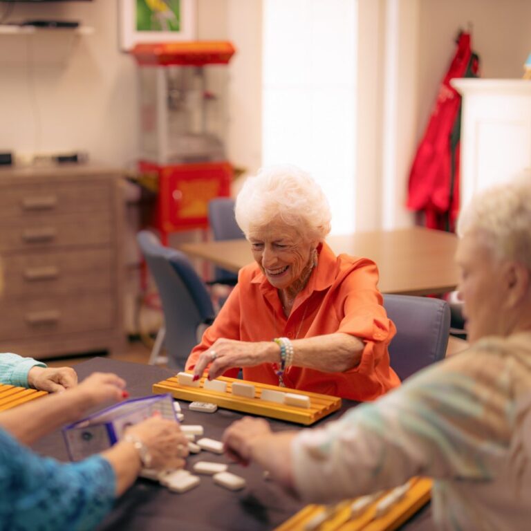 The Hamptons | Seniors playing a board game