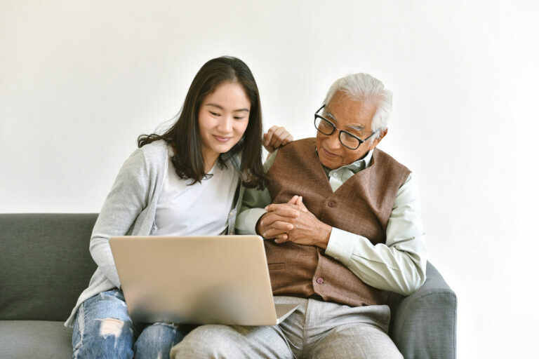 Civitas Senior Living | Senior and granddaughter looking at a laptop