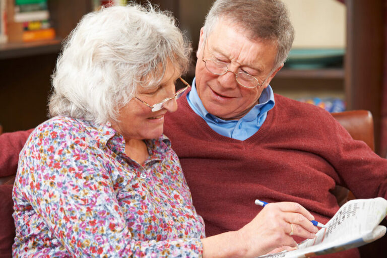 The Ridglea | Senior couple doing a crossword