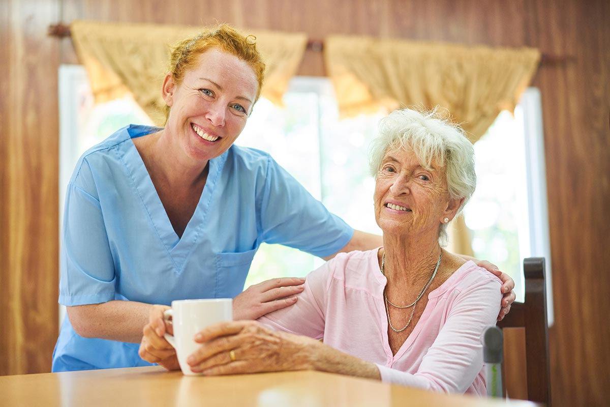 Valley View | Nurse and senior woman smiling