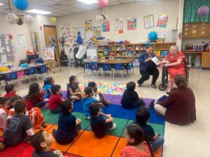 Valley View | Senior Jill reads to children at elementary school where she used to teach