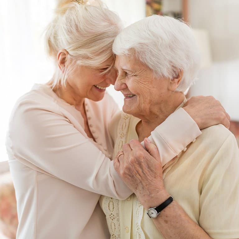 Civitas Senior Living | Senior woman hugging caregiver