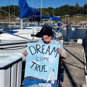 Alexis Pointe of Wimberley | Elizabeth holding a sign that says dream come true