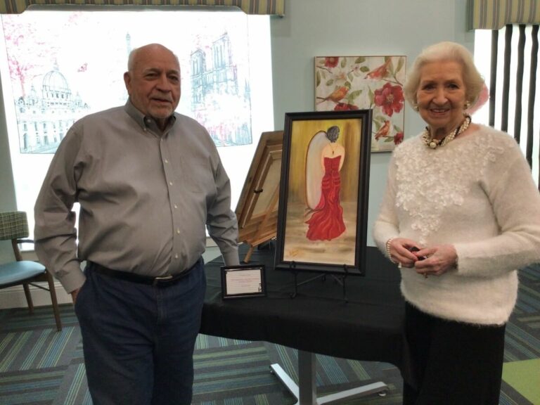 Ariel Pointe of Sachse | Jack and Freda taking a photo with one of their paintings