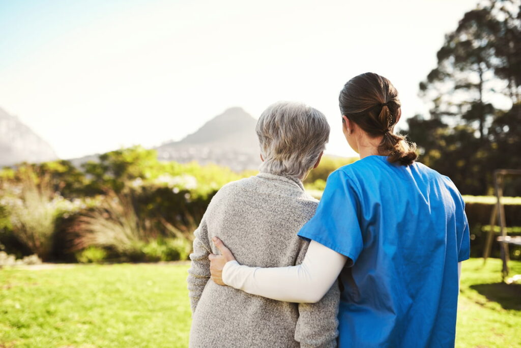 The Bluffs of Flagstaff | Senior woman with caregiver looking at scenic outdoors