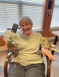 Elan Westpointe | Bobbie and Rascal with flowers