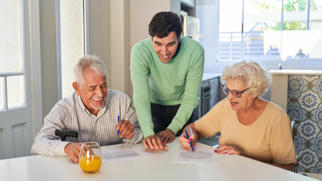 Midtowne | Seniors practicing Memory Care and doing puzzles