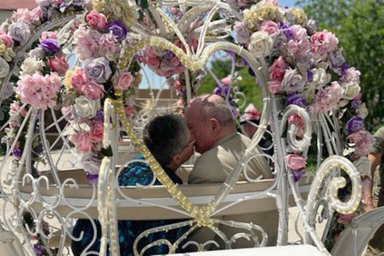 Brooks Of Cibolo | Seniors kissing in a horse drawn carriage