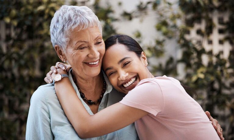 Cambridge Court | Smile, family and an adult daughter hugging a senior mom in a backyard or park for happiness