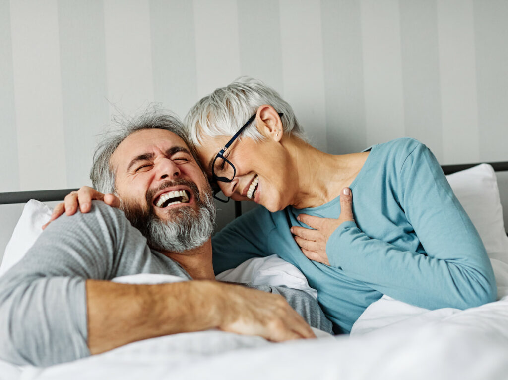 Elk Creek | Senior couple laughing in bed