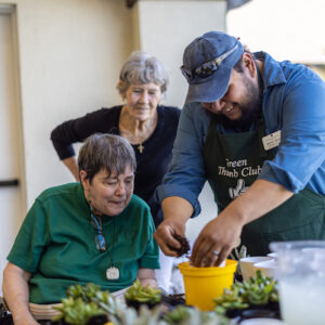 Civitas Senior Living | Seniors potting plants together