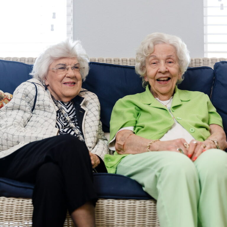 Civitas Senior Living | Two senior residents sitting and laughing