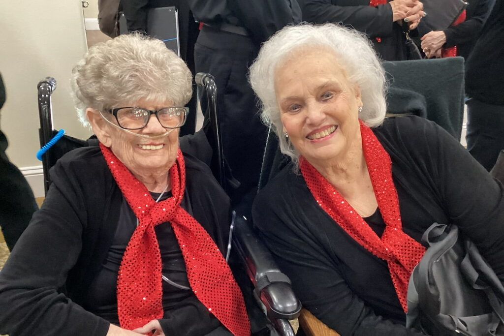 Arabella of Red Oak | Senior sitting with her choir partner during a concert